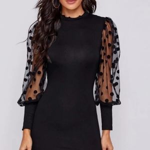 Black mid length dress with sheer sleeve